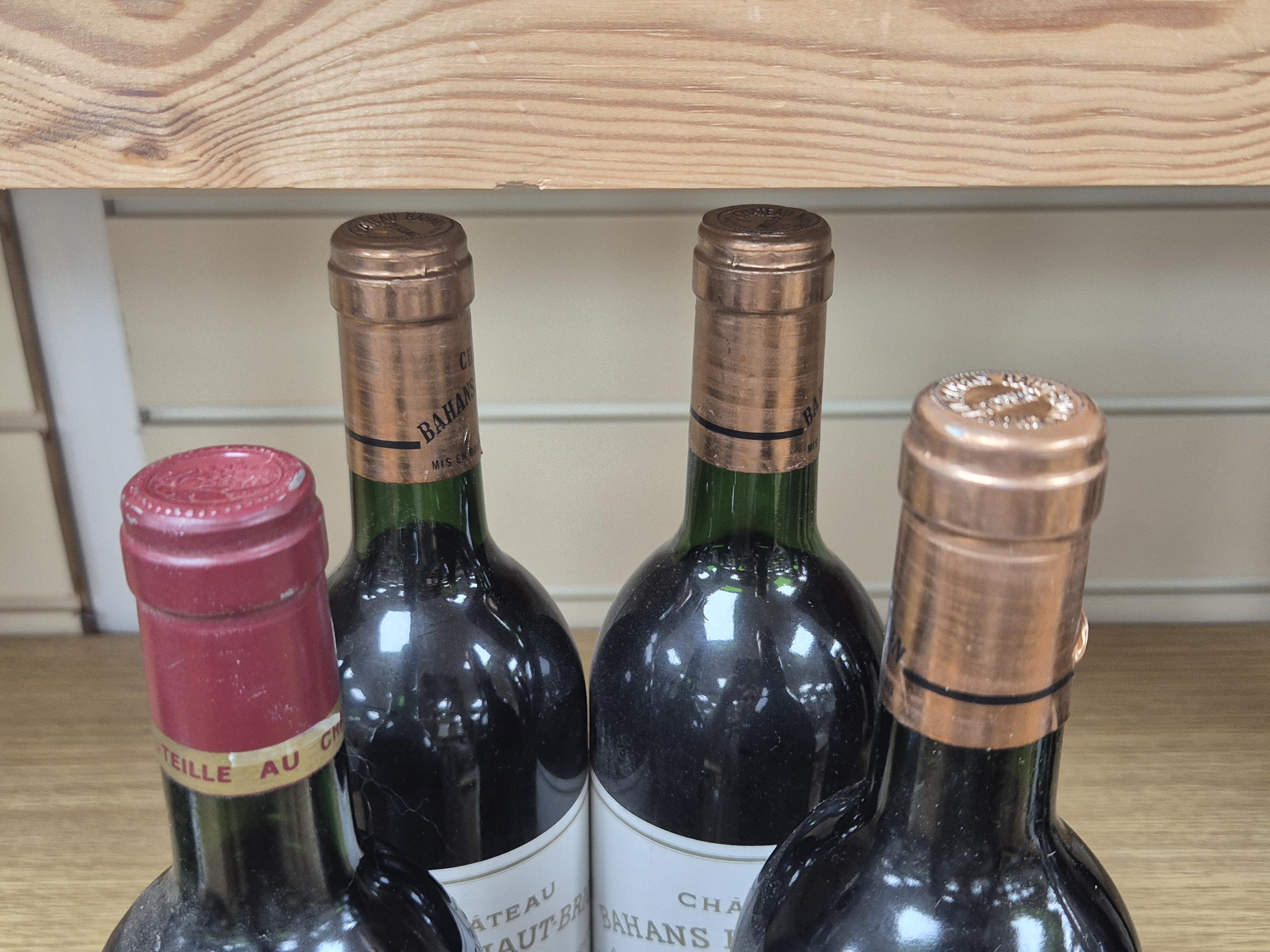 Four bottles of Bordeaux red wine comprising three Chateau Bahans Haut-Brion, 1985 and one Chateau Tour de L'Esperance, 1985